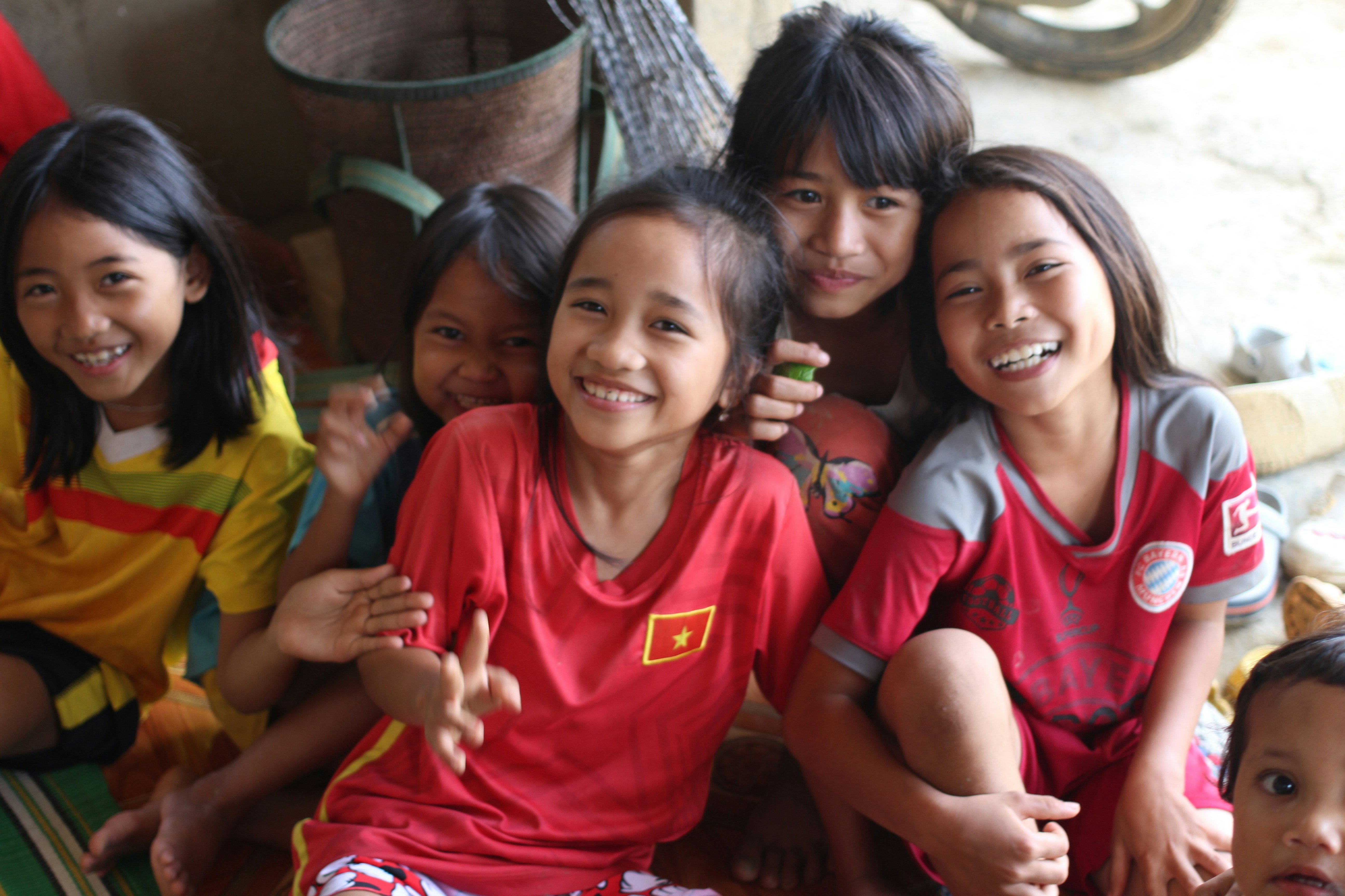 Happy girls wearing colorful sports jerseys