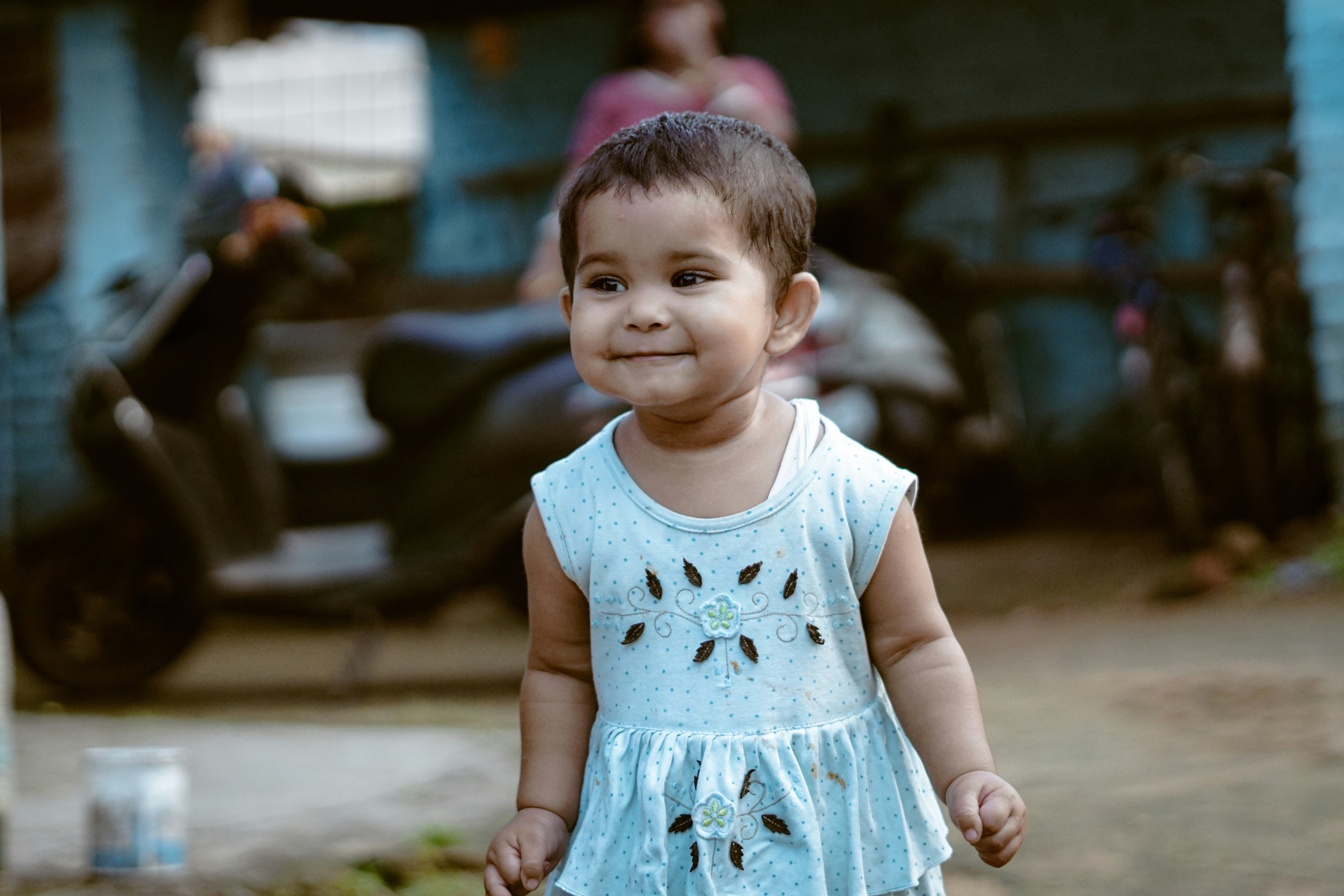 Adorable toddler in light blue dress